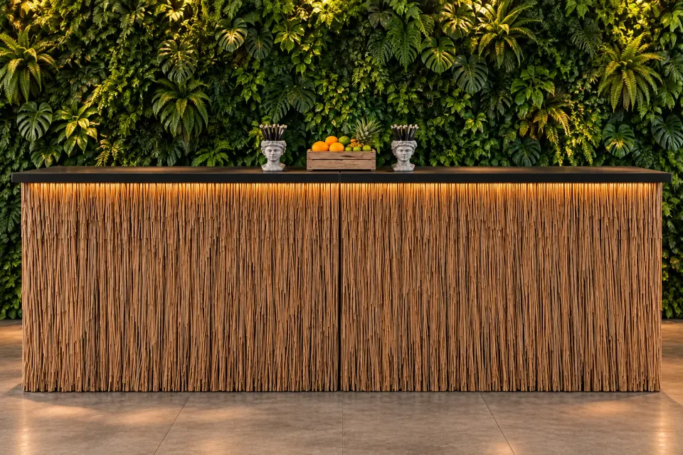 Thatched reed/bamboo mobile bar counter against a green plant-wall backdrop, with under-counter LED lighting