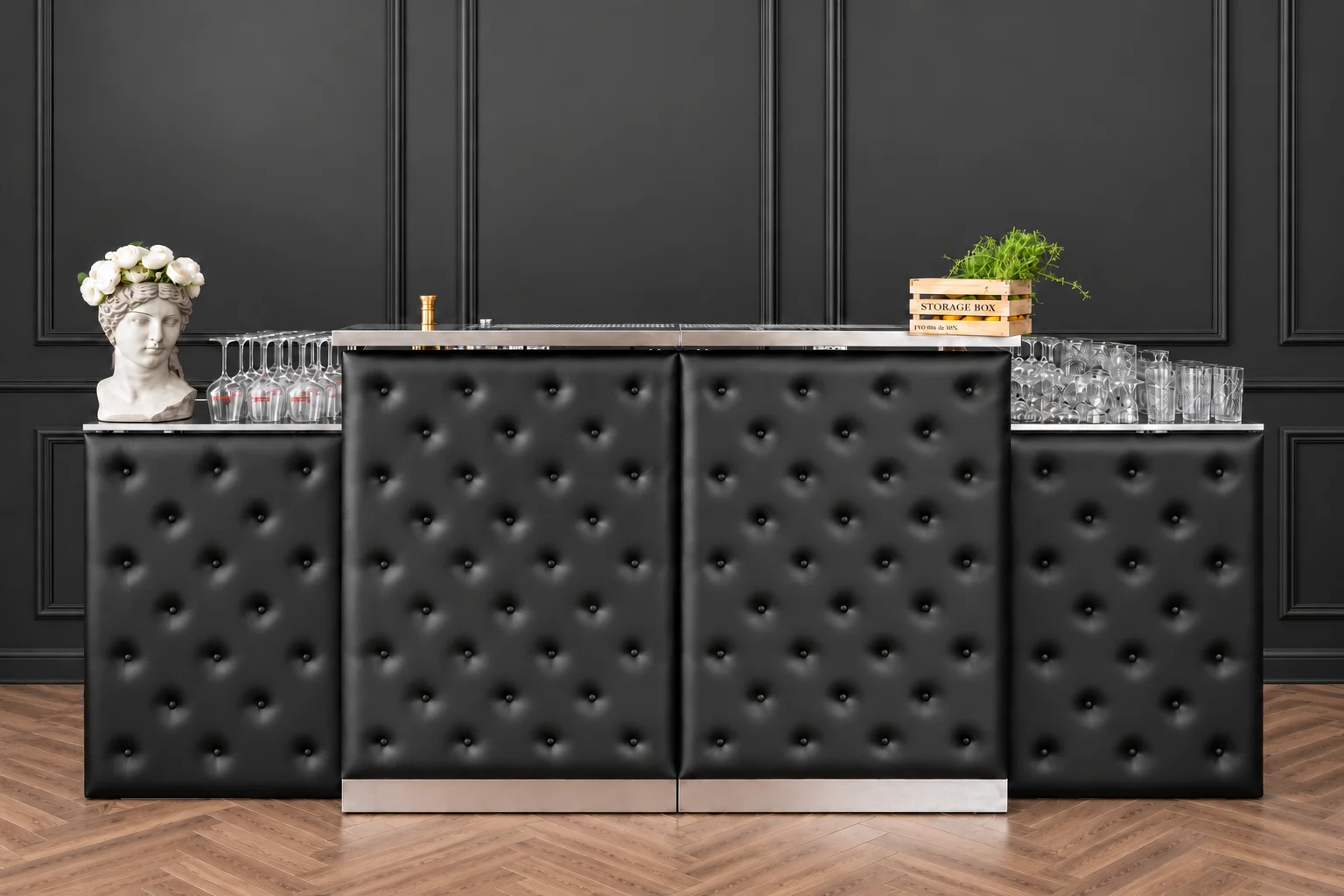 Bartender’s bar counter with a black upholstered front panel — the surface a client’s branding goes on